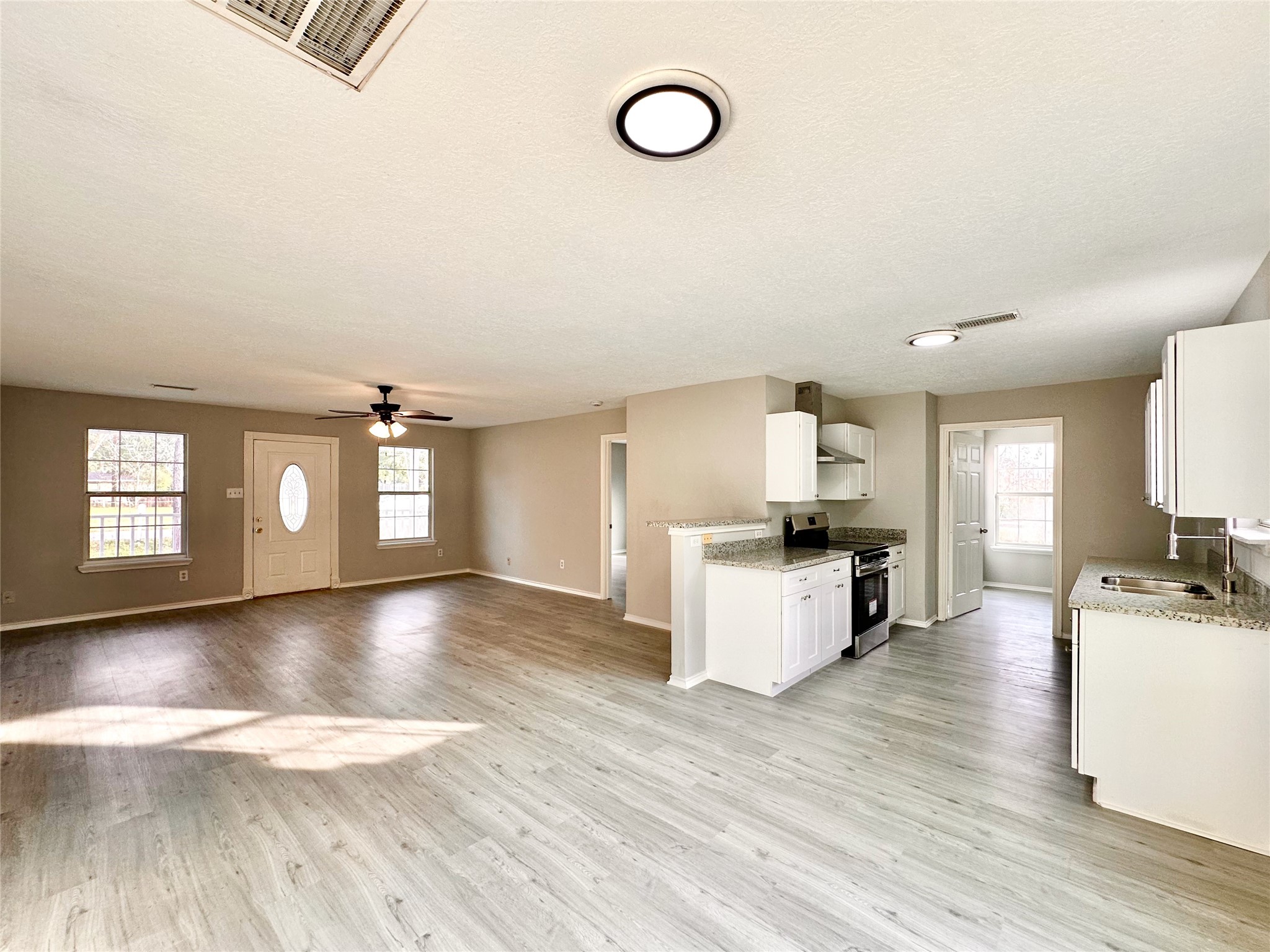 15134 Alkay Street Houston, TX 77053 - Photo 6 of 25 a kitchen with a refrigerator and a stove top oven