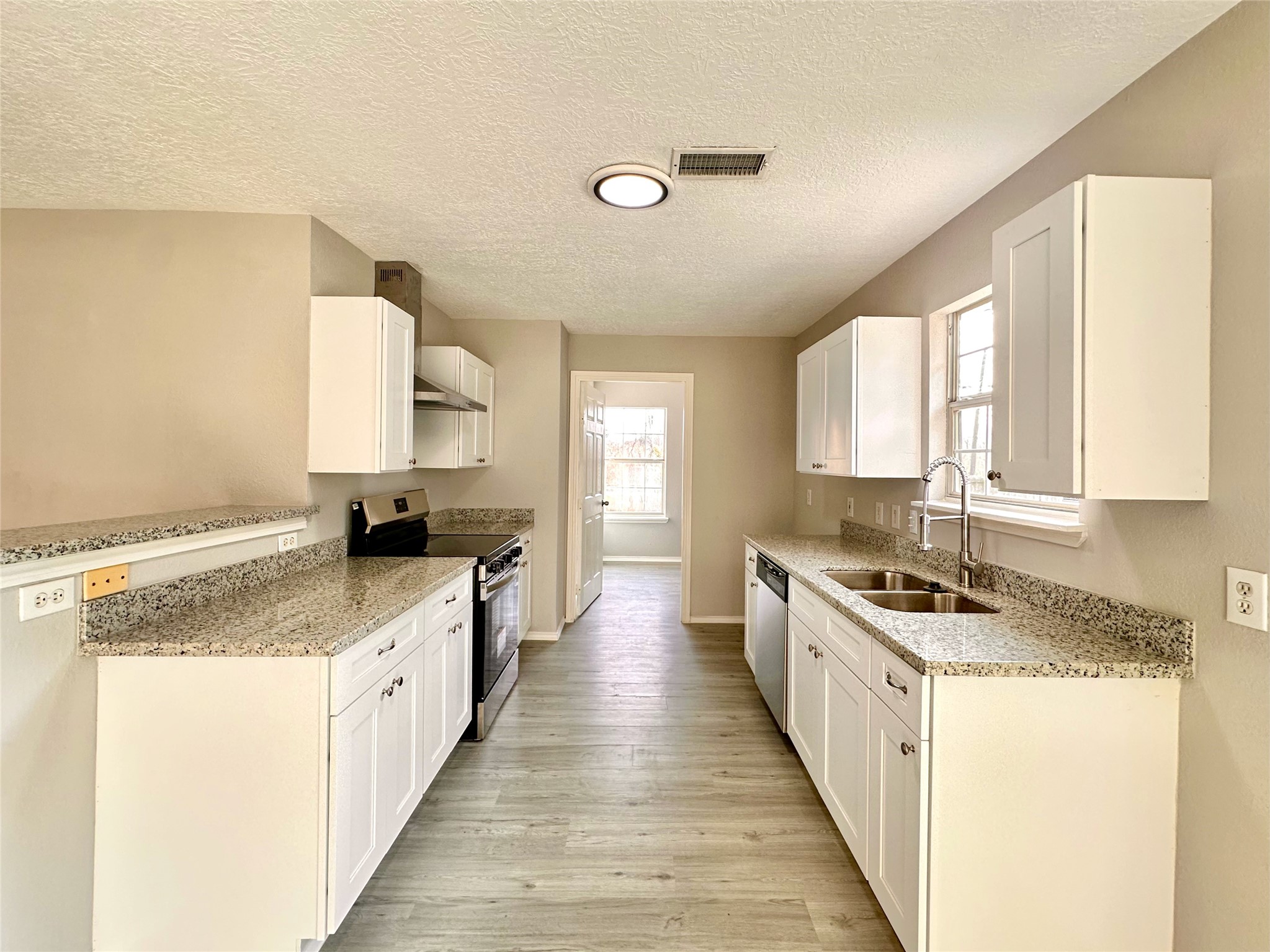15134 Alkay Street Houston, TX 77053 - Photo 8 of 25 a kitchen with sink stove and cabinets