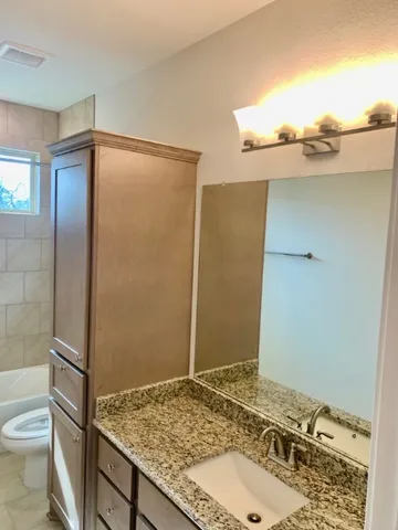 a bathroom with a sink and a toilet