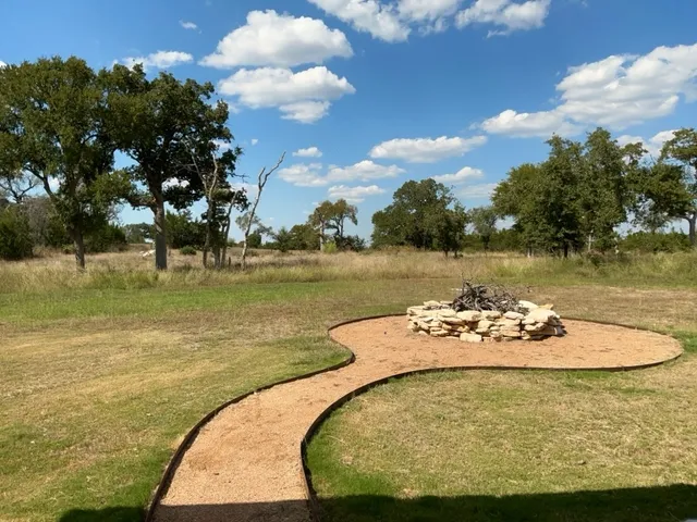 a view of a lake with couches chairs