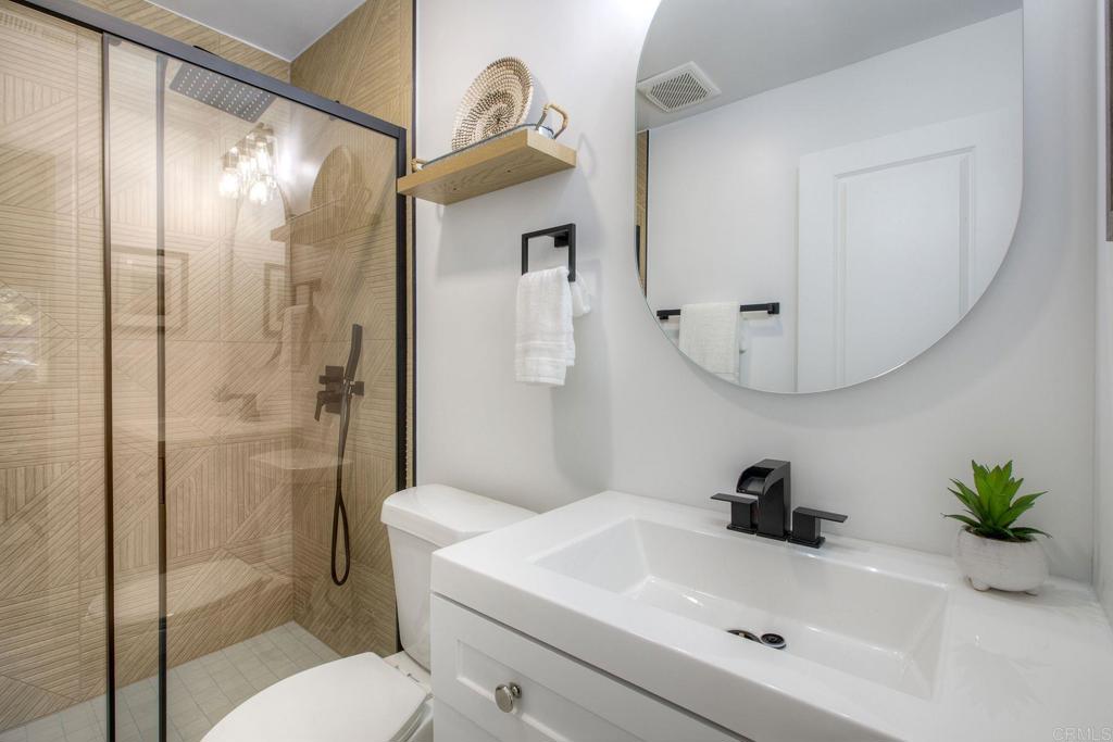 728 Hackberry Place Fallbrook, CA 92028 - Photo 12 of 23 a bathroom with a sink a toilet and shower