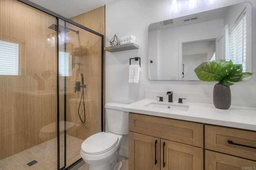 728 Hackberry Place Fallbrook, CA 92028 - Photo 15 of 23 a bathroom with a sink a toilet and shower