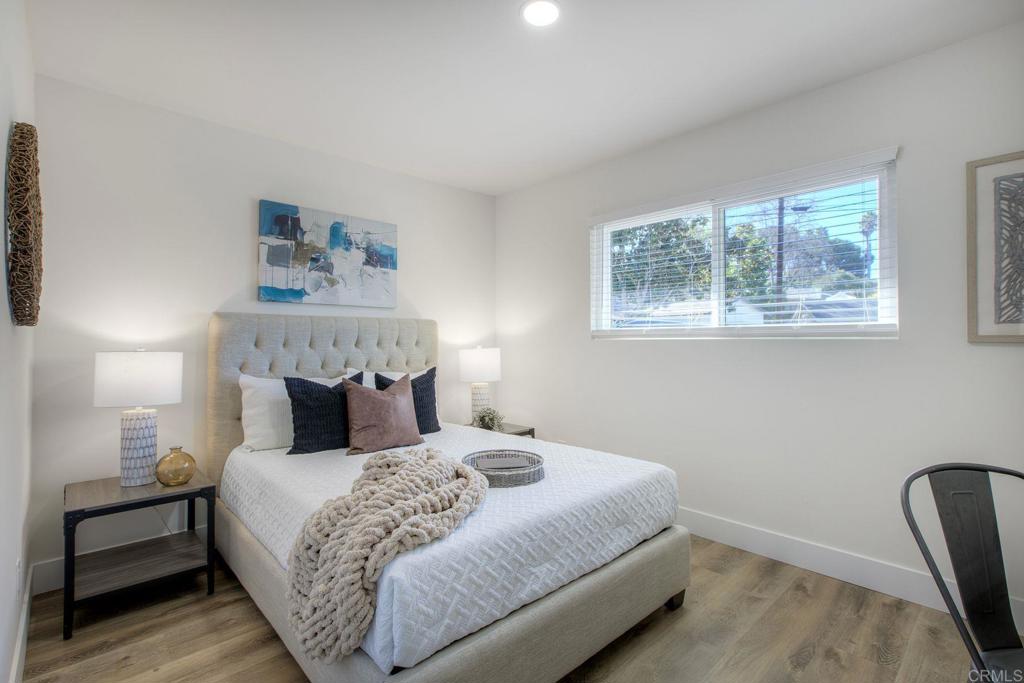 728 Hackberry Place Fallbrook, CA 92028 - Photo 16 of 23 a bedroom with a bed and a painting on the wall