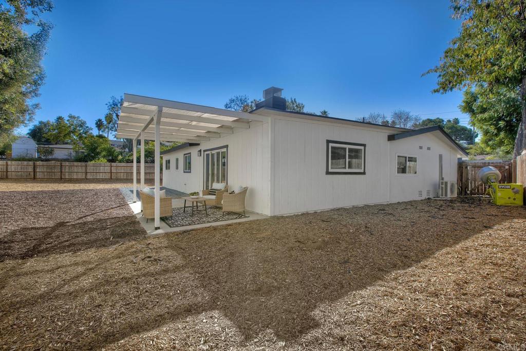 728 Hackberry Place Fallbrook, CA 92028 - Photo 19 of 23 a view of a house with backyard and a tree