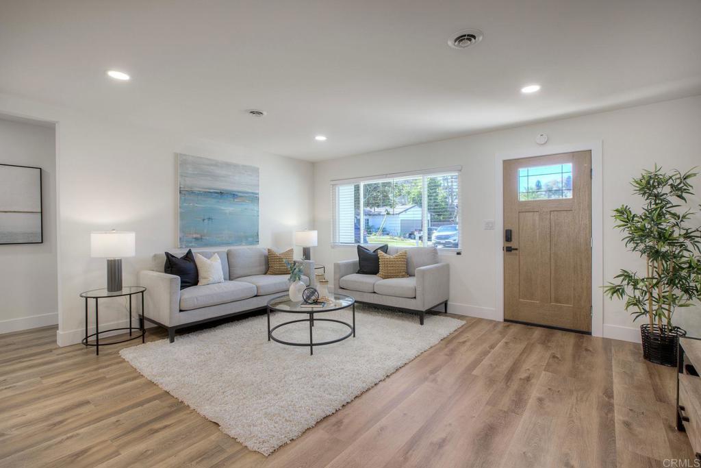 728 Hackberry Place Fallbrook, CA 92028 - Photo 3 of 23 a living room with furniture and a potted plant