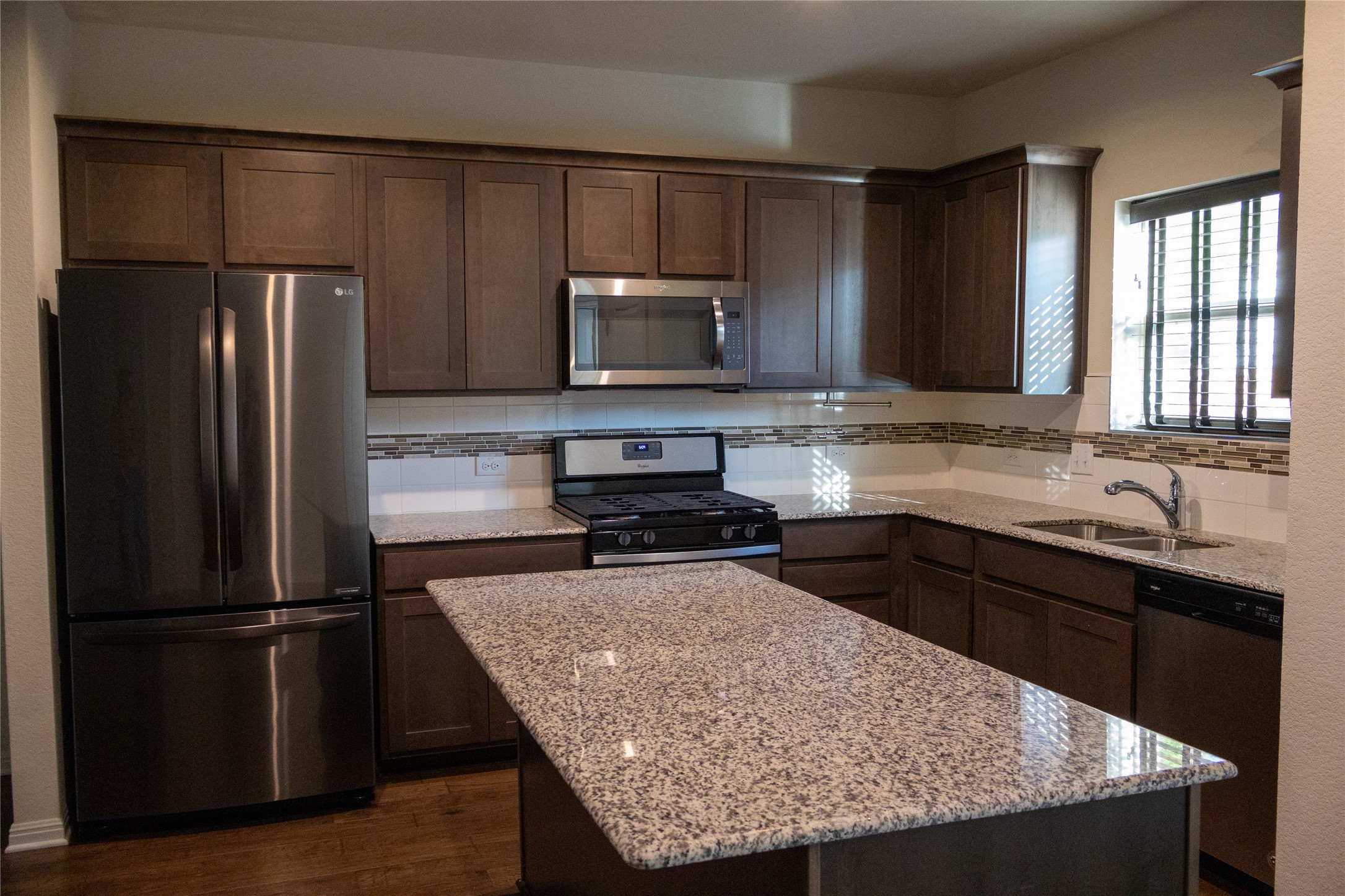 5801 Charles Merle Dr., Unit A Austin, TX 78747 - Photo 6 of 22 Stainless steel refrigerator conveys with property.