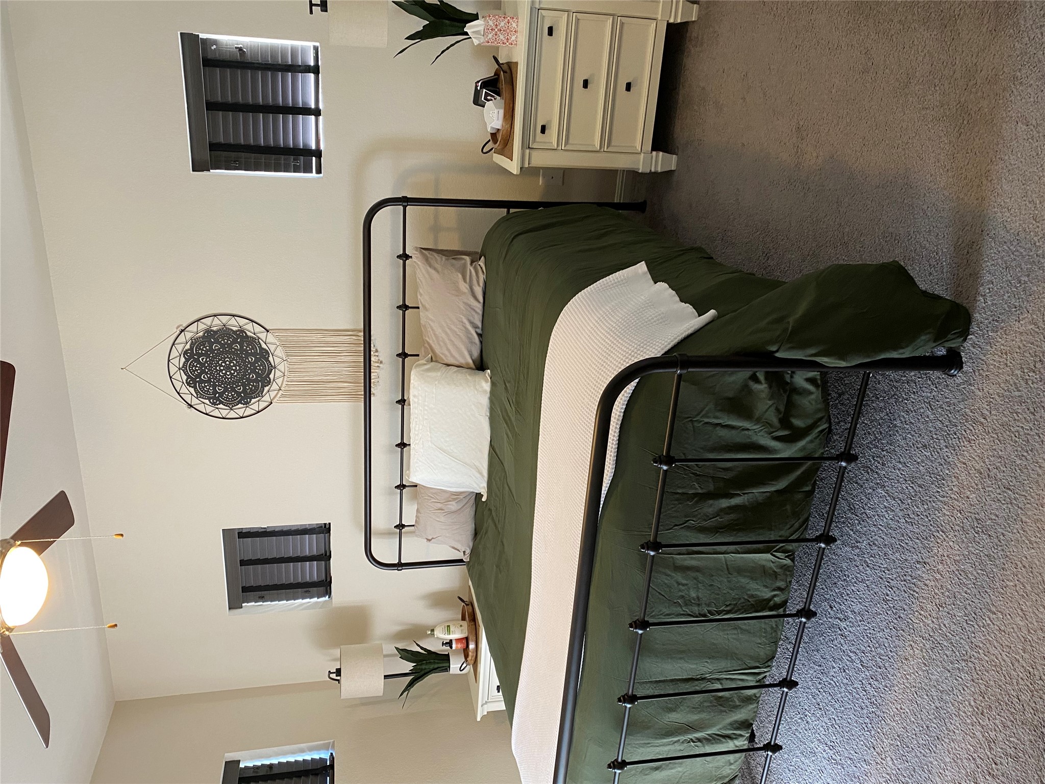 5801 Charles Merle Dr., Unit A Austin, TX 78747 - Photo 9 of 22 Primary bedroom with two closets and carpeted flooring. Previously occupied by tenant.