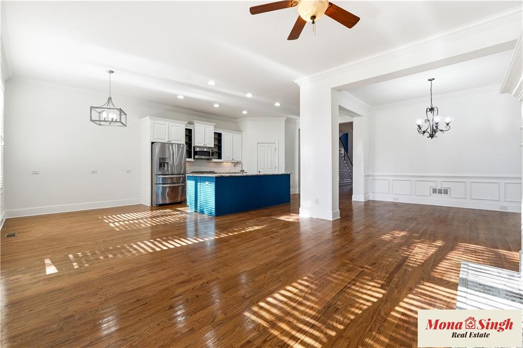 6961 Fellowship Lane Flowery Branch, GA 30542 - Photo 11 of 47 a view of kitchen and hall with wooden floor