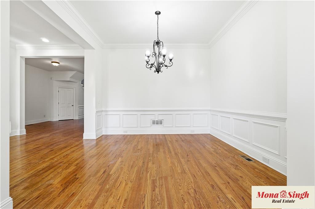 6961 Fellowship Lane Flowery Branch, GA 30542 - Photo 17 of 47 a view of a room with wooden floor