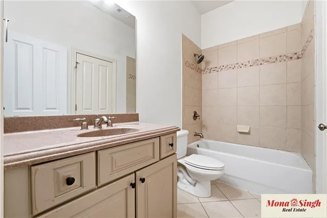 a bathroom with a sink a toilet and a bathtub