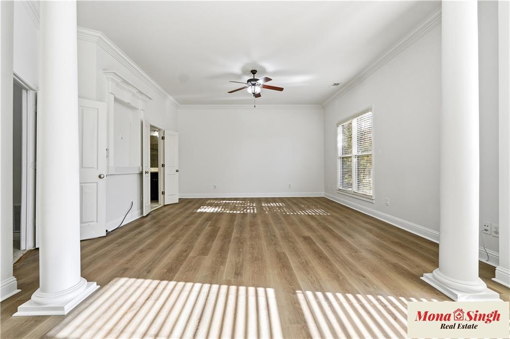 6961 Fellowship Lane Flowery Branch, GA 30542 - Photo 25 of 47 wooden floor in an empty room with a window