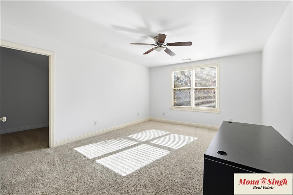 6961 Fellowship Lane Flowery Branch, GA 30542 - Photo 32 of 47 a view of an empty room with a window