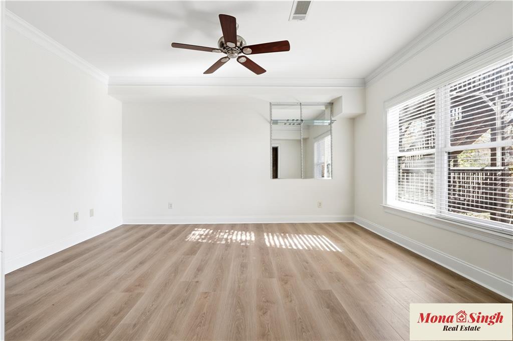6961 Fellowship Lane Flowery Branch, GA 30542 - Photo 37 of 47 wooden floor in an empty room with a window