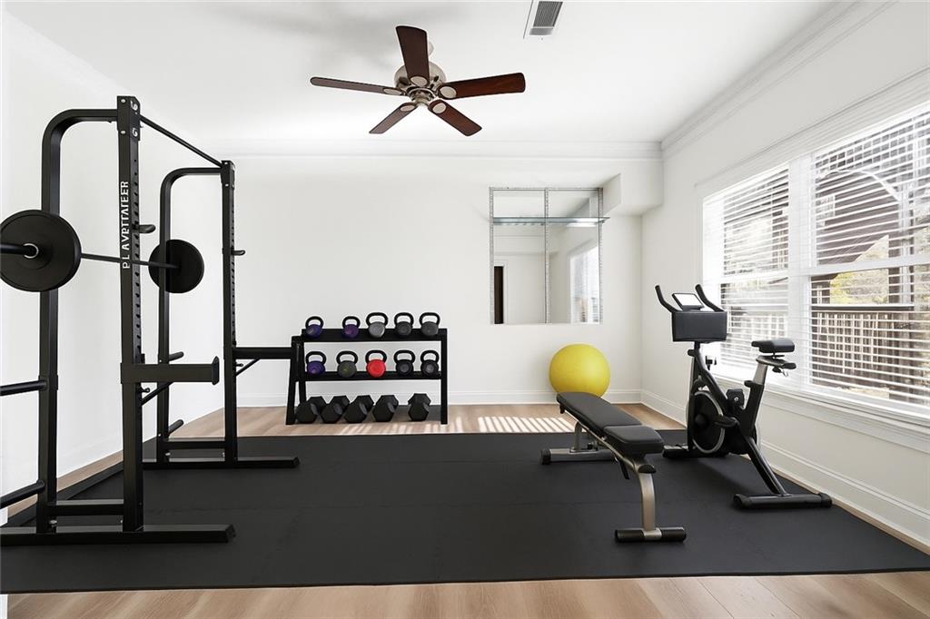 6961 Fellowship Lane Flowery Branch, GA 30542 - Photo 38 of 47 a view of a workspace with furniture and a window