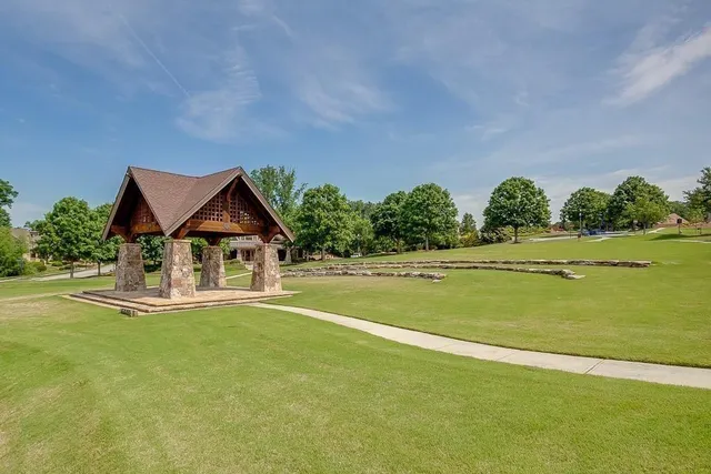 a front view of a house with a big yard