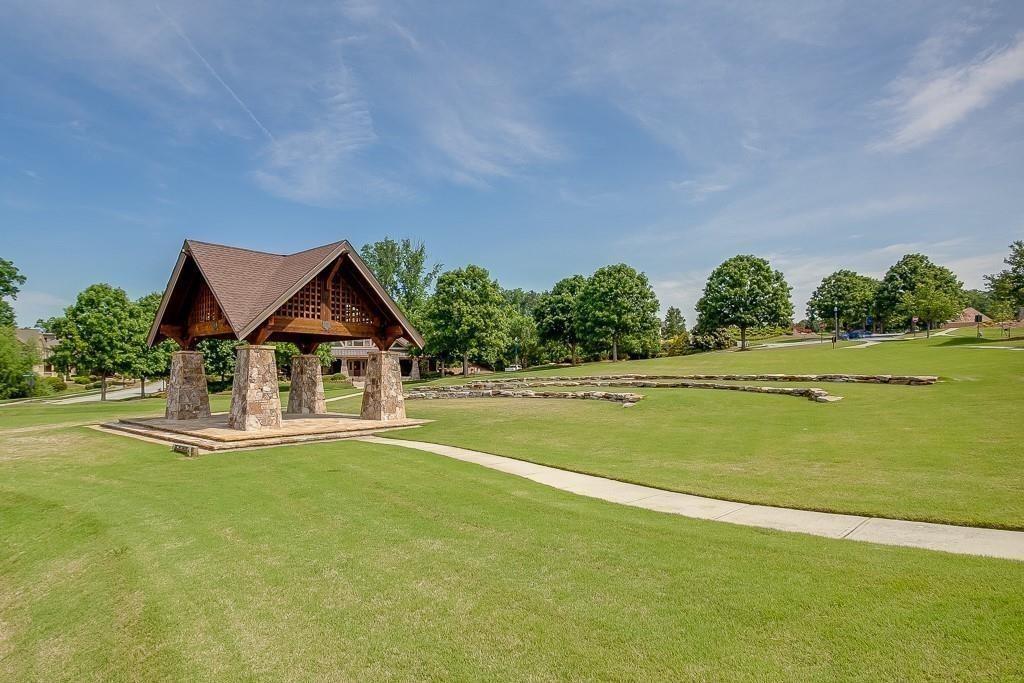 6961 Fellowship Lane Flowery Branch, GA 30542 - Photo 41 of 47 a front view of a house with a big yard