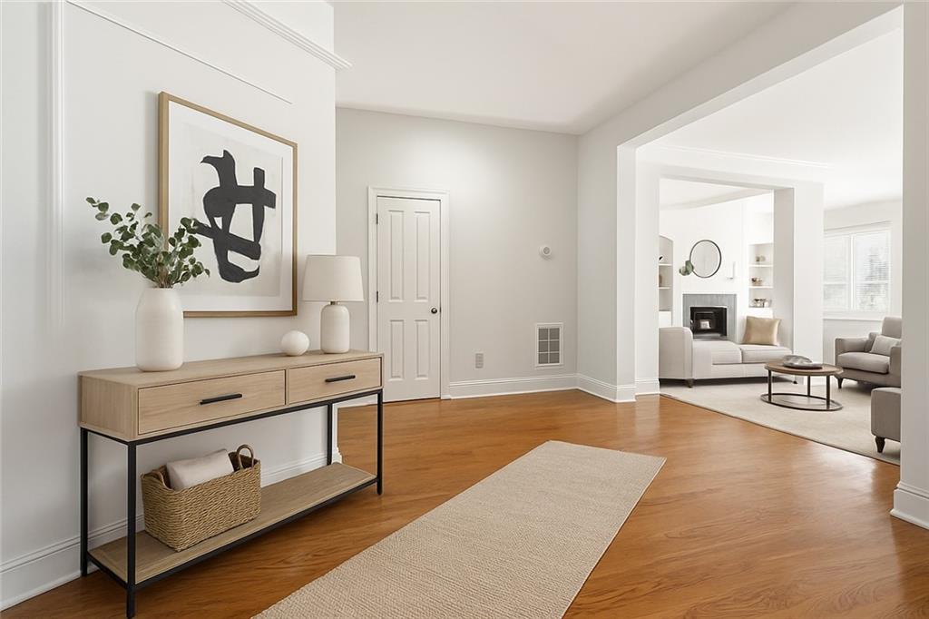 6961 Fellowship Lane Flowery Branch, GA 30542 - Photo 5 of 47 a living room with furniture and wooden floor