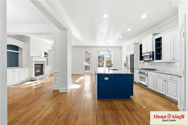 a view of kitchen with sink and wooden floor