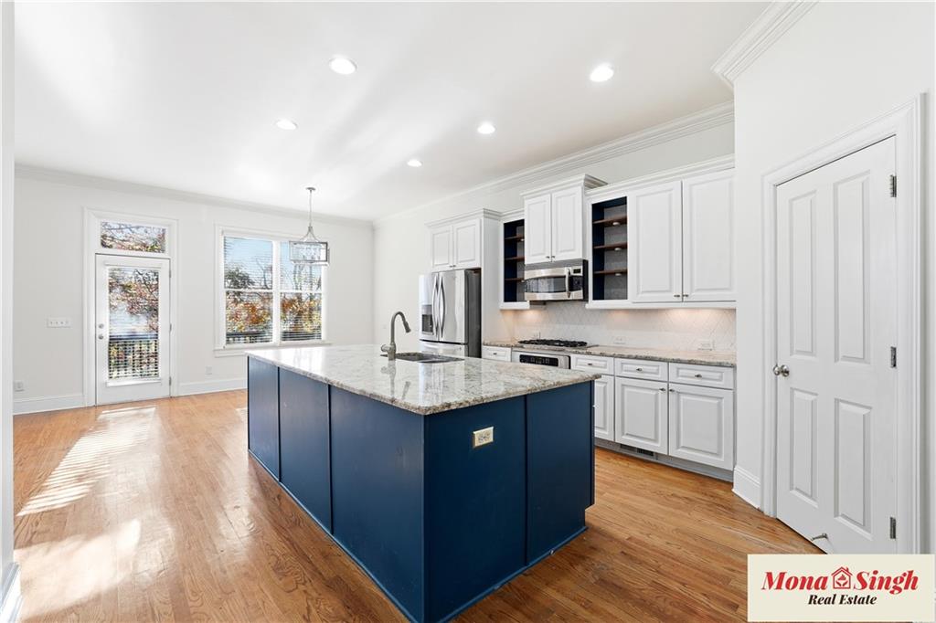 6961 Fellowship Lane Flowery Branch, GA 30542 - Photo 8 of 47 a kitchen with sink stove and cabinets