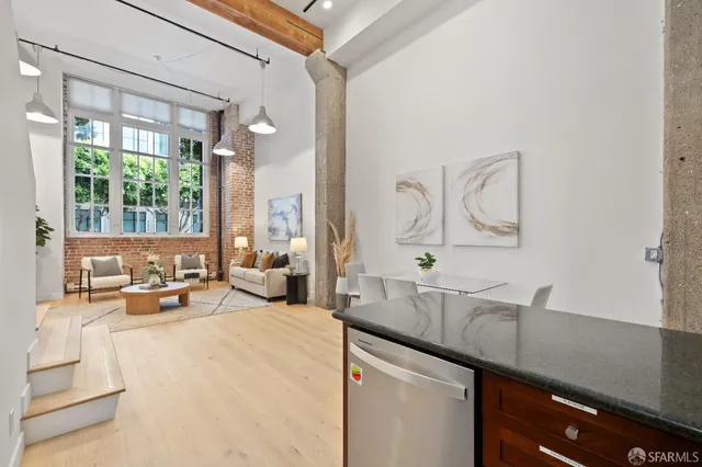 a very nice looking room with a large window and sitting area