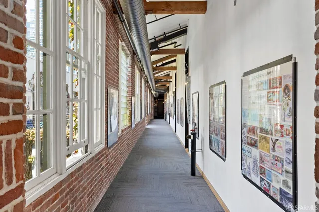 a view of a hallway with windows