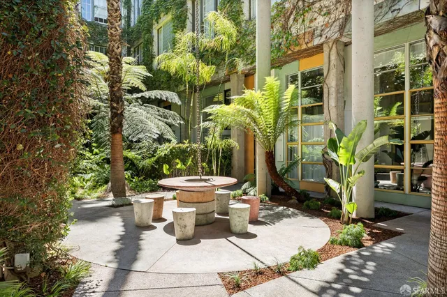 a view of a chairs and table in the patio