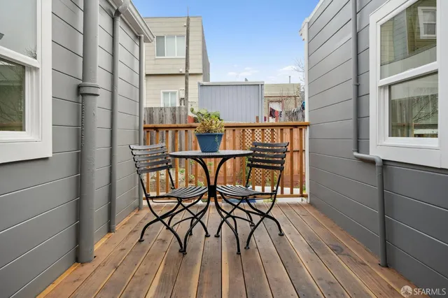 a view of a balcony with chairs