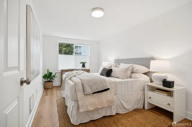 a bedroom with a bed and window