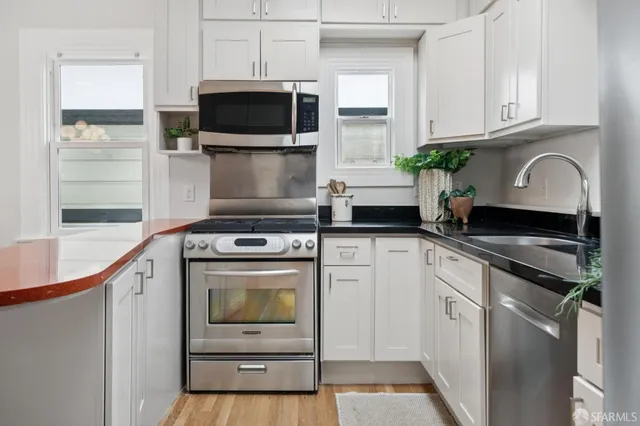 a kitchen with a stove and a microwave