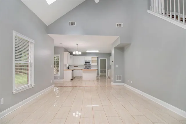 a view of kitchen with livingroom and window