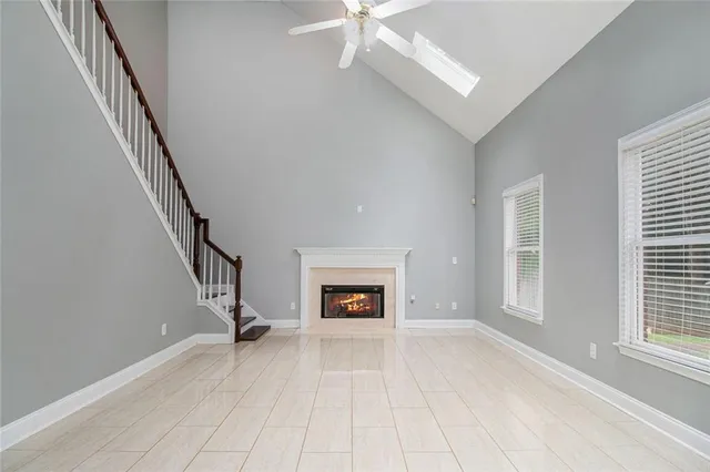 a view of a livingroom with wooden floor and fireplace