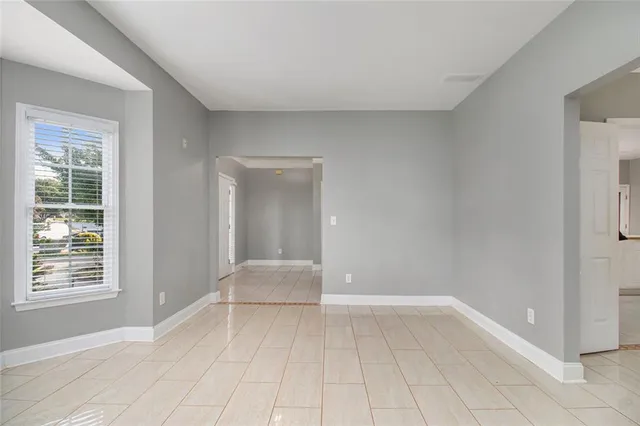 a view of an empty room with glass door