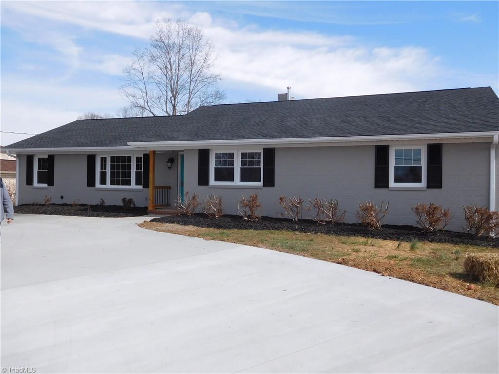 8529 Lasater Road Clemmons, NC 27012 - Photo 2 of 30 All New Roof & Gutters. Fresh exterior paint. Newly Landscaped and new front concrete circular driveway. It doesn't look large in the Photo but it really is! You won't believe how much space & storage is in this home.
