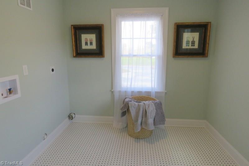 8529 Lasater Road Clemmons, NC 27012 - Photo 11 of 30 Walk-in Laundry has tons of natural light.