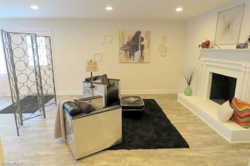 8529 Lasater Road Clemmons, NC 27012 - Photo 21 of 30 Finished Basement. 2nd Fireplace in Den. Basement is also a large open room with many possibilities.
