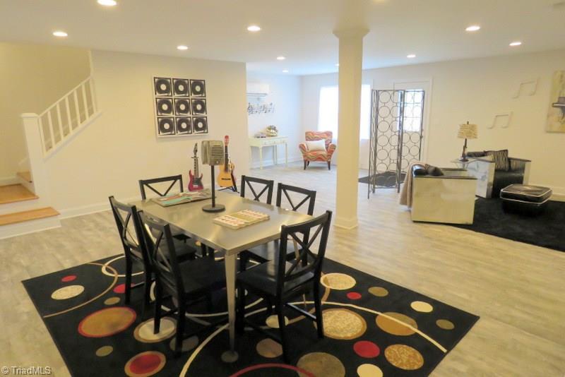 8529 Lasater Road Clemmons, NC 27012 - Photo 25 of 30 Basement. Door leads out to large patio. There is also an oversized two car basement garage. This space is perfect for kids, teenagers, man cave, 2nd living area. This home has more square footage than you realize!