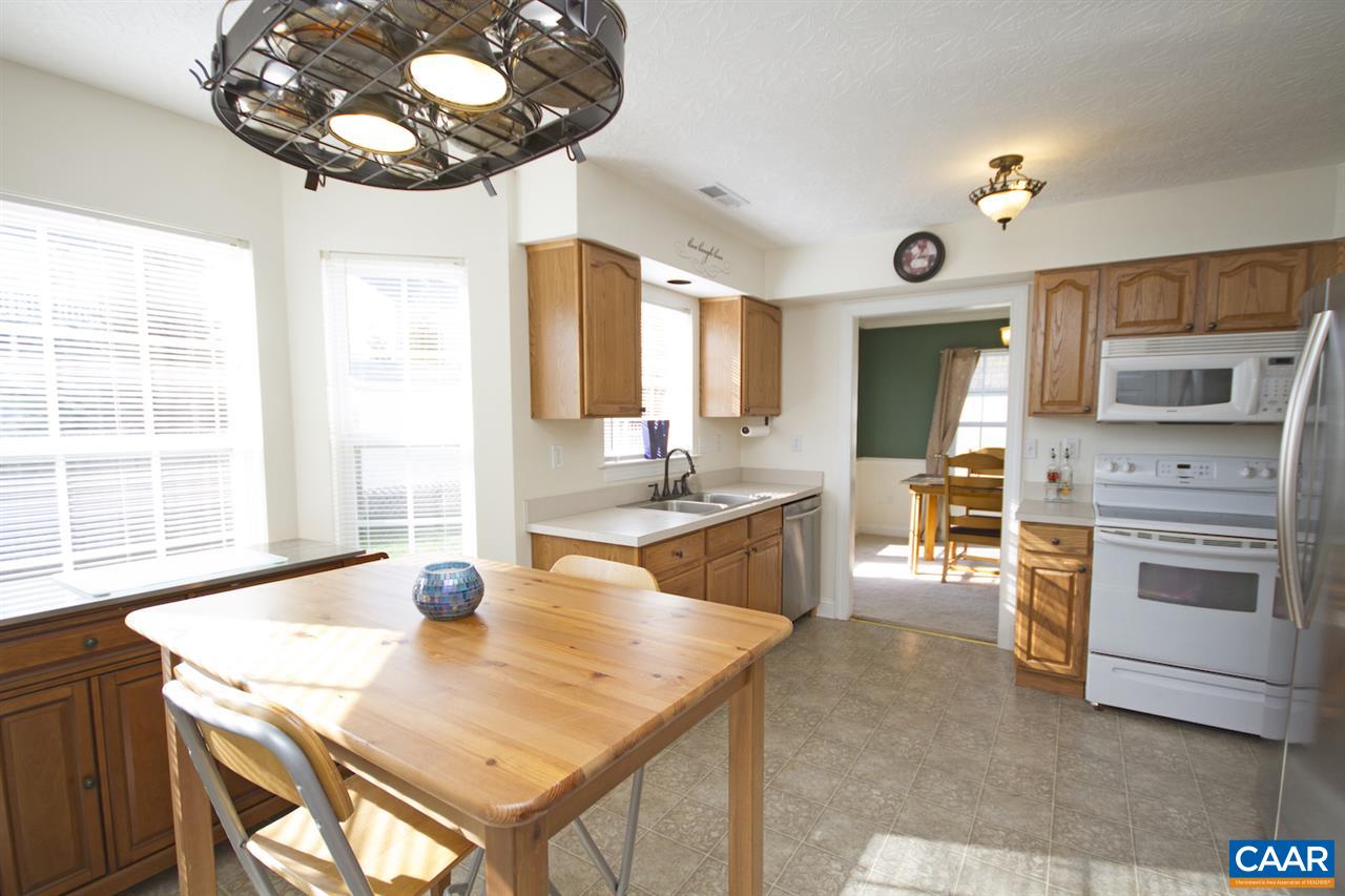 216 Inglecress Road Waynesboro, VA 22980 - Photo 11 of 28 a kitchen with stainless steel appliances wooden floor dining table and chairs
