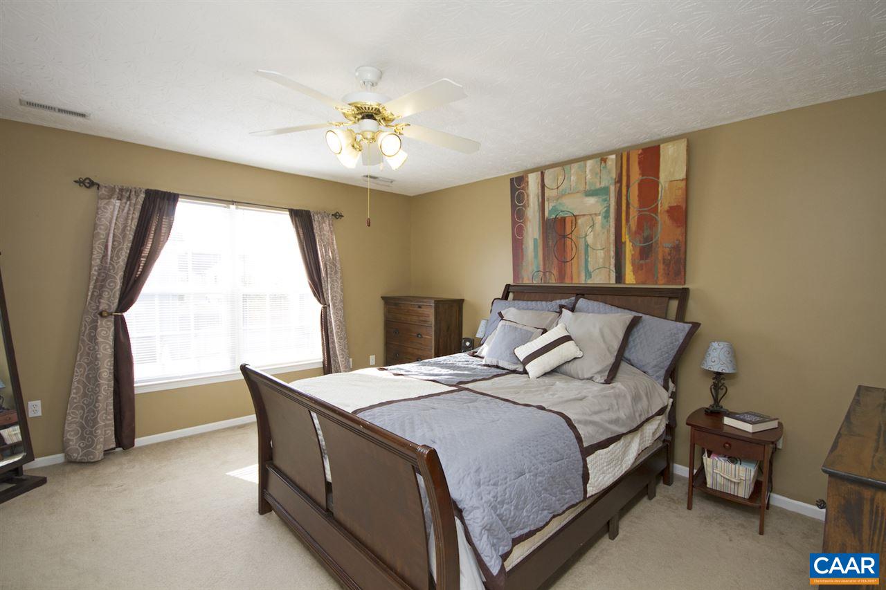 216 Inglecress Road Waynesboro, VA 22980 - Photo 18 of 28 a bedroom with a bed and a chandelier