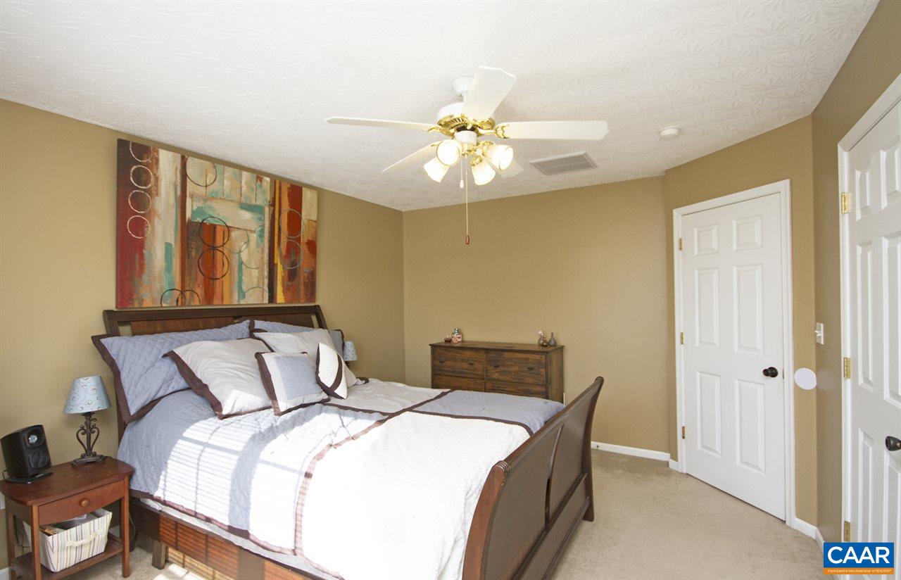 216 Inglecress Road Waynesboro, VA 22980 - Photo 19 of 28 a bedroom with a bed and a chandelier