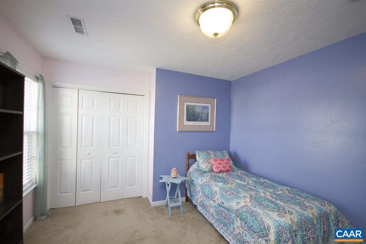 216 Inglecress Road Waynesboro, VA 22980 - Photo 24 of 28 a bedroom with a bed and a chandelier