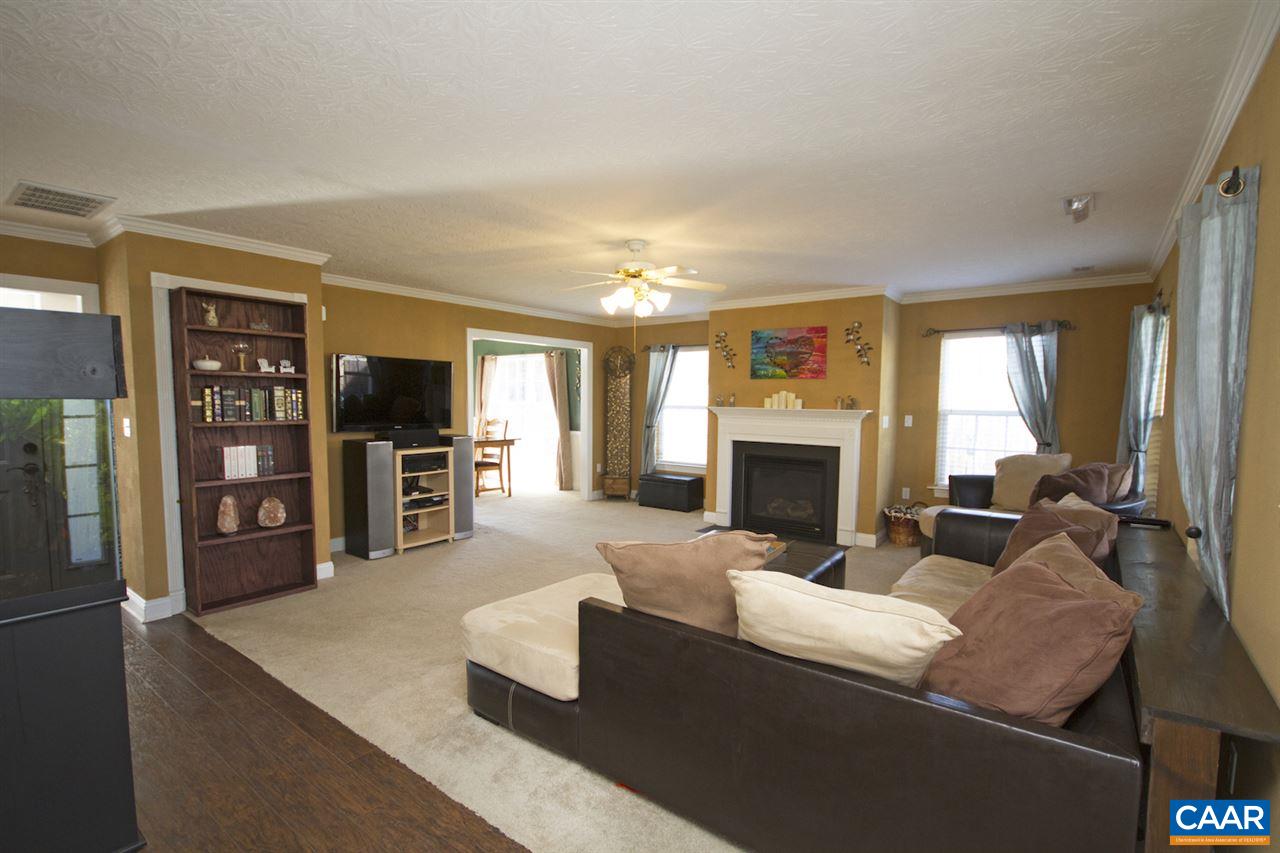 216 Inglecress Road Waynesboro, VA 22980 - Photo 5 of 28 a living room with furniture a fireplace and a flat screen tv