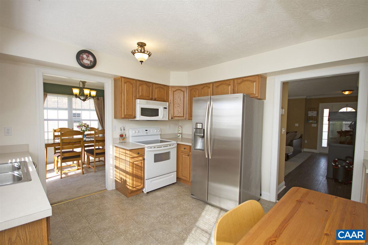 216 Inglecress Road Waynesboro, VA 22980 - Photo 9 of 28 a kitchen with stainless steel appliances kitchen island granite countertop a refrigerator a stove top oven a sink and dishwasher