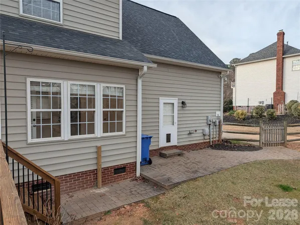 a view of a house with a stairs and a yard