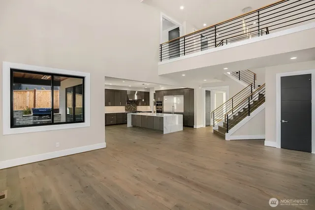 a view of an entryway with wooden floor
