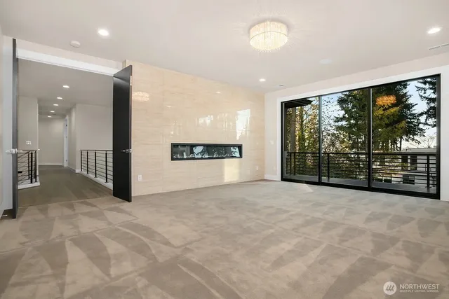 a view of an empty room with a large window