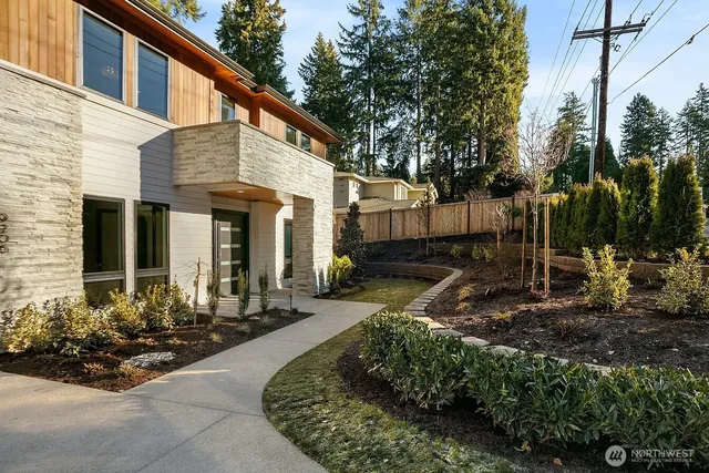 a front view of a house with garden