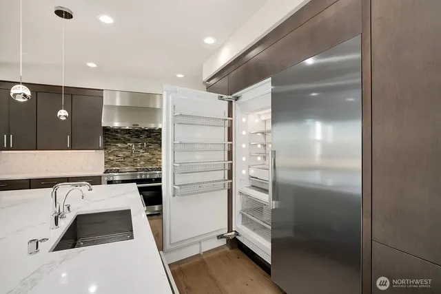 a bathroom with a shower and a sink