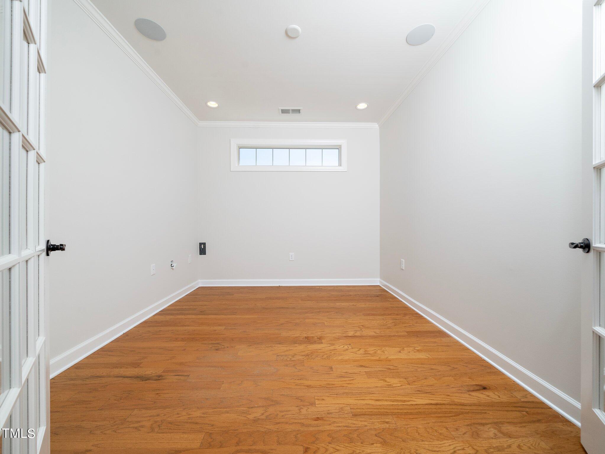 1356 Prevenient Drive Wake Forest, NC 27587 - Photo 15 of 27 an empty room with a empty space and windows