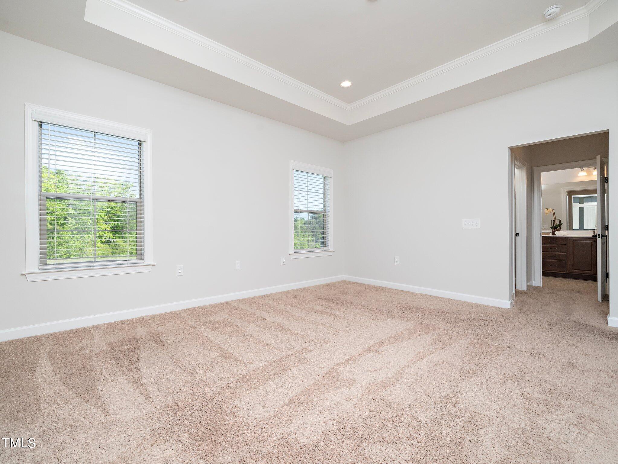 1356 Prevenient Drive Wake Forest, NC 27587 - Photo 17 of 27 an empty room with windows