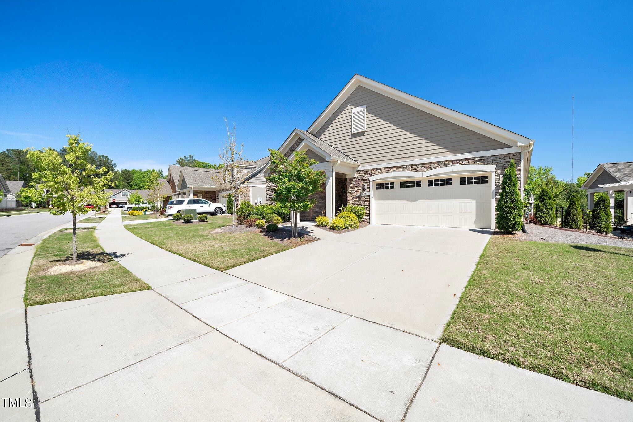 1356 Prevenient Drive Wake Forest, NC 27587 - Photo 2 of 27 a front view of a house with a yard